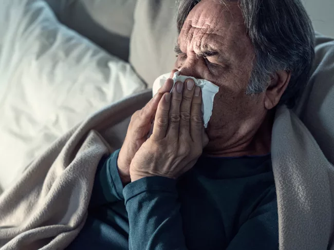 Senior man suffering from cold and flu