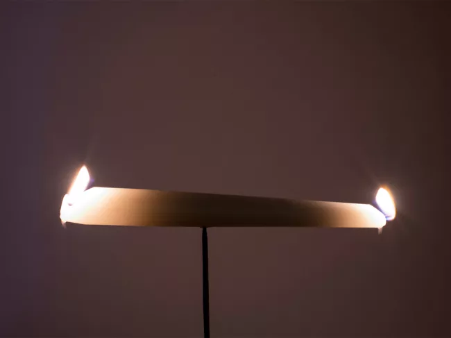 Photo of candle burning at both ends