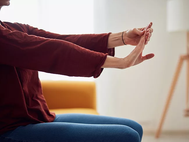 Woman stretching her arms and hands