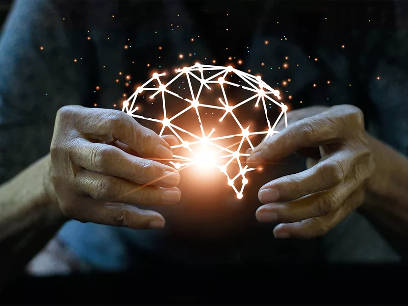 Elderly hands holding broken brain structure Elderly hands holding broken brain structure