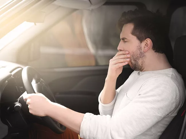 Man falling asleep in car