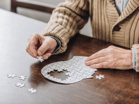 Man piecing together a puzzle