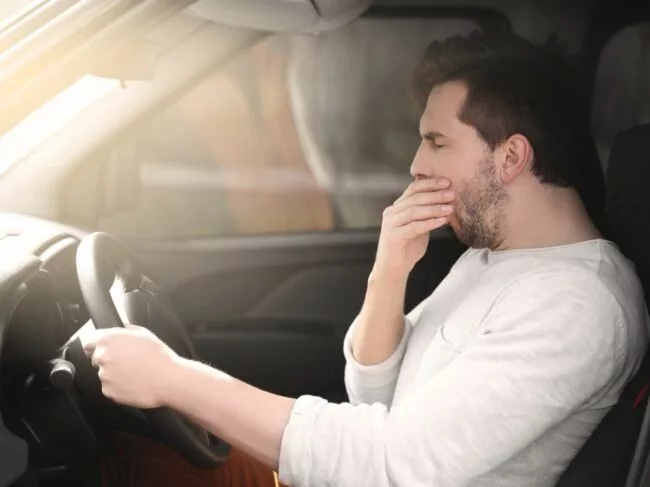 Man falling asleep in car