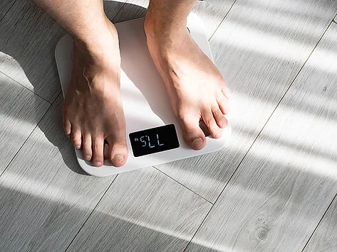 Male feet on scale