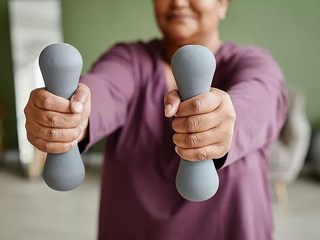 Woman exercising with hand weights