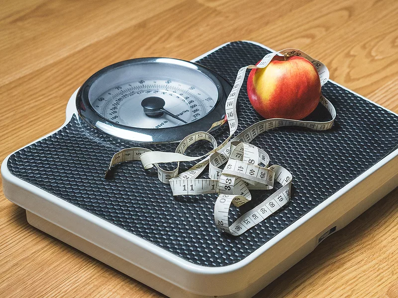 Tape measure, apple on scale Tape measure, apple on scale