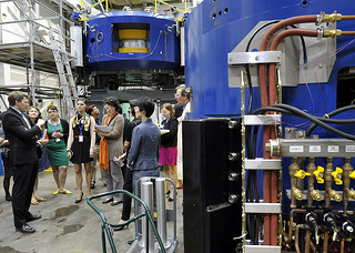 Richard Wassenaar, PhD, of Best Theratronics shows journalists the company's Cyclotron systems